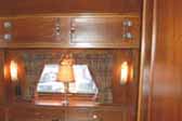 Beautiful wood cabinetwork and dining table in 1938 Kozy Coach Trailer